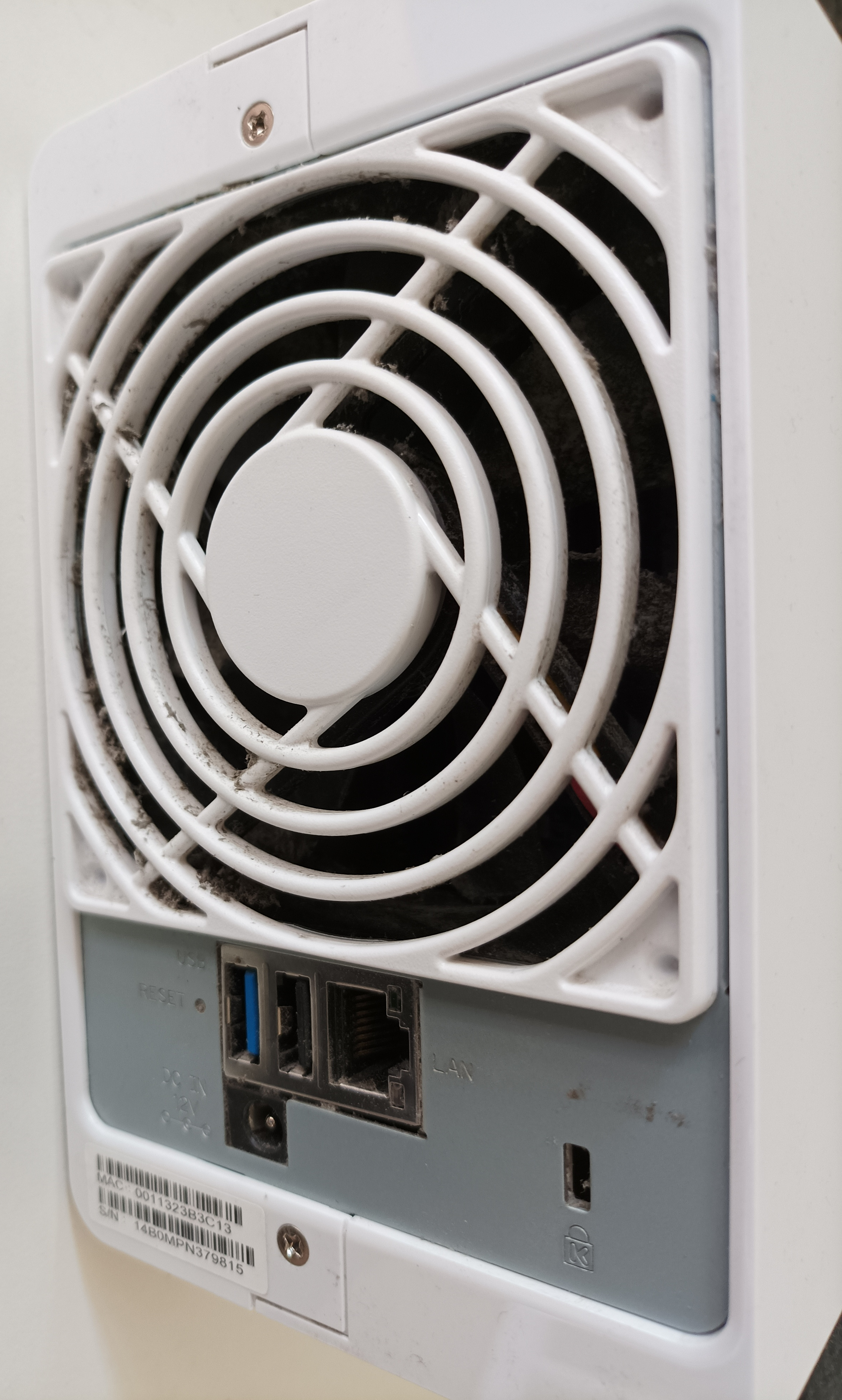 The rear of a Synology DS215j NAS showing the fan and rear screws.